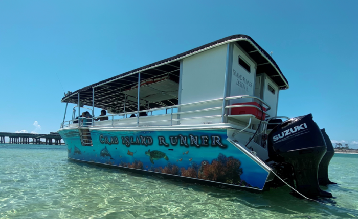 the crab island runner boat in the clear water