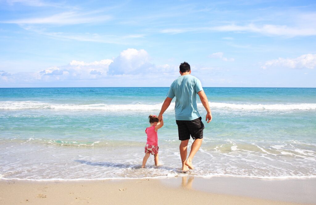 father and daughter at the beach in Destin in August