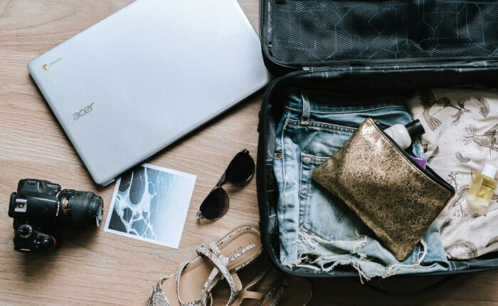 a flat lay of stylish work-travel items