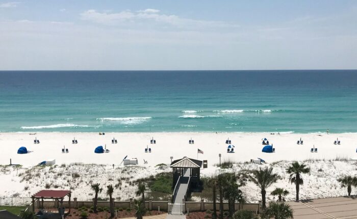 a view of the beach from a balcony