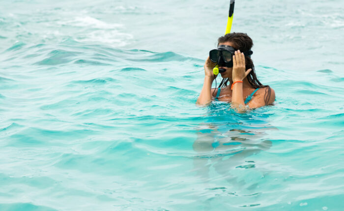 Woman swimming in the sea with a snorkeling mask